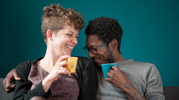 couple laughing and drinking tea