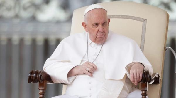 A recent image of Pope Francis sitting in a chair.