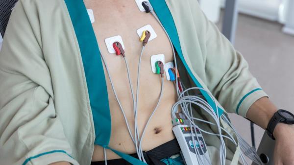 Person with electrodes on their chest.